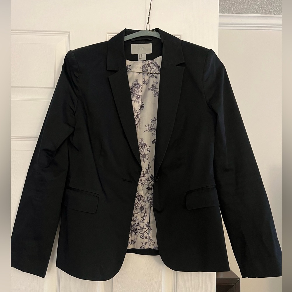 Simple black blazer with a floral lining.